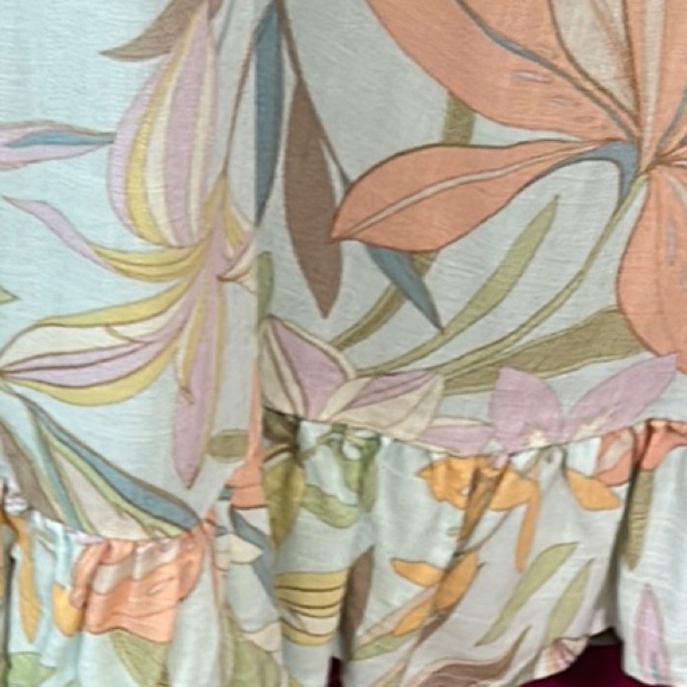 O'Neill loose fitting dress. Tropical flowers in pastel colors with ruffled hem.